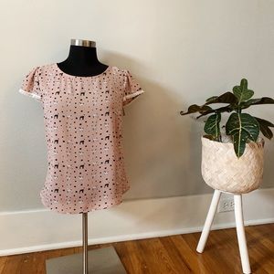 Puppy dog patterned pink blouse
